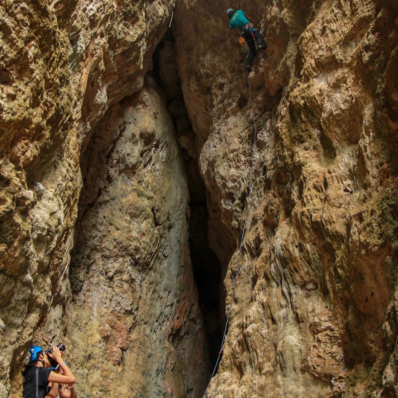 a man sitting on a rock