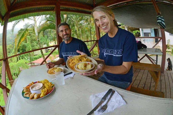 a man sitting at a table eating food