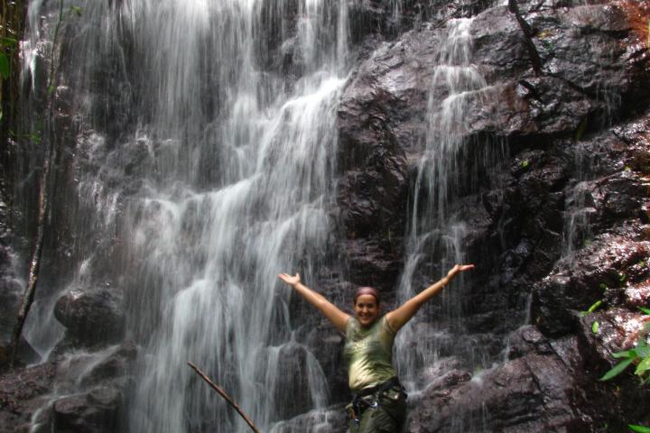 a large waterfall over some water